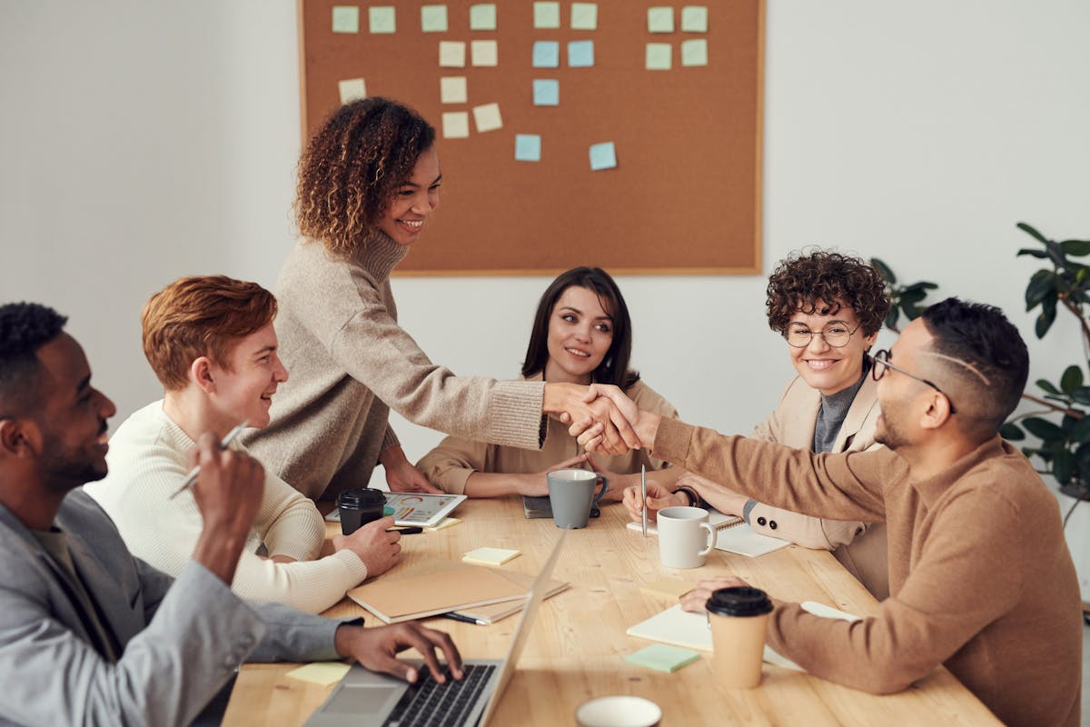 Diverse group of MBA students collaborating around a conference table